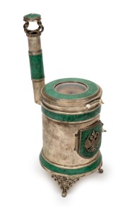 A novelty Eastern European silver and malachite miniature stove ornament, housing a pocket watch movement, bearing the Russian coat of arms, unknown maker and origin (marks illegible), 20th century, 18cm high, 322 grams total including watch movement.