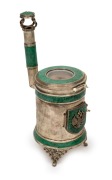 A novelty Eastern European silver and malachite miniature stove ornament, housing a pocket watch movement, bearing the Russian coat of arms, unknown maker and origin (marks illegible), 20th century, 18cm high, 322 grams total including watch movement.