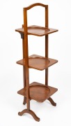 An antique English mahogany Sheraton Revival folding three tier cake stand, early 20th century, 95cm high, 31cm wide, 28cm deep.
