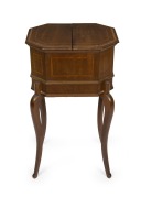 An antique English mahogany and satinwood Sheraton Revival worktable, interior handsomely fitted with water washed Lincoln green silk, lift-out tray and compartments, 19th/20th century, 72cm high, 41cm wide, 35cm deep.