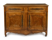 An antique French sycamore and fruitwood two drawer two door cabinet with applied metal decoration, 18th/19th century, 97cm high, 134cm wide, 52cm deep.