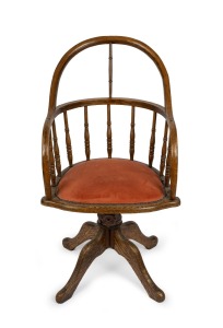 An antique American oak swivel base captain's chair, 19th century, 52cm across the arms.