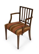 A Georgian mahogany Hepplewhite design armchair with elbow supports and reeded back rests, circa 1770, 86cm high, 55cm across the arms.