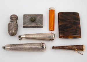 An antique sterling silver scent bottle, together with two silver cigarette holding cases, two cigarette holders (one with gold mount, the other in sterling silver, plus a Mexican silver pill box and a tortoise shell box, 19th/20th century, (7 items total). the largest 7cm long.