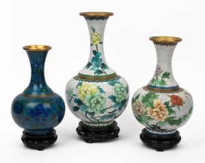 Three vintage Chinese cloisonne vases on timber stands, 20th century, the largest 35cm high.
