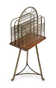 An antique American oak and gilt metal revolving magazine stand, 19th/20th century, 84cm high, 37cm wide, 33cm deep.