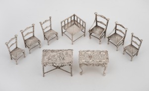 Nine pieces of antique and vintage silver dolls house furniture, the larger table 7.5cm wide, 86 grams total.