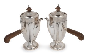 A pair of antique English sterling silver chocolate pots with carved timber handles and finials, by Addie Bros. of Birmingham, 20th century, 20cm high, 812 grams total including handles and finials.