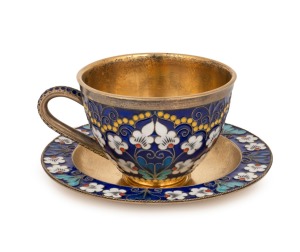 A Russian silver teacup and saucer with enamel floral decoration and original gilt finish, stamped "916" with Soviet assay mark and Cyrillic maker's mark, the saucer 11cm diameter, 233 grams total.