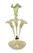 An antique English vaseline glass four trumpet epergne, 19th century, 59cm high.