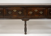 An antique English oak four drawer dresser base with original brass hardware and baluster turned legs, 18th century, 84cm high, 241cm wide, 45cm deep. - 3