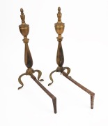 A pair of antique brass fire dogs with cabriole legs and urn decoration, 20th century, 46cm high, 18cm wide, 32cm deep.