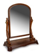 An antique English carved mahogany toilet mirror, circa 1850, ​​​​​​​78cm high, 66cm wide, 28cm deep.