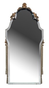 A vintage Art Deco shaped and bevelled mirror with applied decoration, circa 1930, ​​​​​​​85 x 41cm overall.