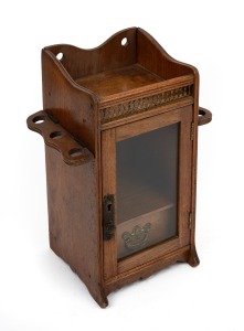 An antique walnut humidor tobacco cabinet with gilt metal gallery and drop side pipe holders, late 19th century, 32cm high.
