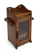 An antique walnut humidor tobacco cabinet with gilt metal gallery and drop side pipe holders, late 19th century, ​​​​​​​32cm high.