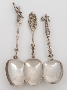Three assorted antique Continental silver serving spoons all with figural finials, 18th/19th century, the largest 19cm high, 146 grams total.