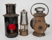 An antique coach lantern; together with an antique signal lantern and an ECCLES "Protector" lamp, 19th/20th century, (3 items), the largest 30cm high. - 2