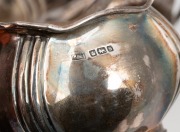 A three piece antique English sterling silver tea service, made in Sheffield, circa 1910, the teapot 13cm high, 25cm wide, 668 grams total including handle. - 2