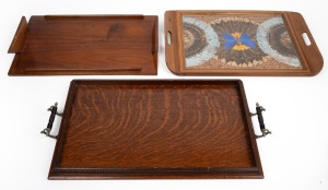 Three vintage serving trays, including butterfly wing, oak and homemade blackwood examples, early to mid 20th century, the largest 62cm across the handles.