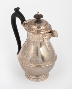 A sterling silver jug with carved timber handle and finial, made in Sheffield, early 20th century, 17cm high, 422 grams total including handle and finial.
