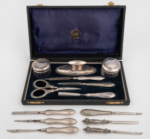 A boxed sterling silver vanity set and a collection of assorted sterling silver handled vanity implements, 19th/20th century, (qty), the box 22cm wide.