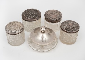 Five assorted antique and vintage sterling silver topped vanity jars, 19th/20th century, the largest 12cm diameter, 112 grams silver weight.