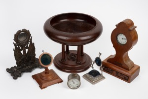 Antique and vintage pocket watch holders; together with antique Australian blackwood comport, a carved timber clock and a "Baby B" American nickel plated clock, 19th and 20th century, (6 items), the clock 27cm high.