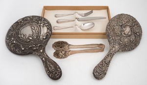 Two antique sterling silver hand-mirrors; together with a Continental silver three piece cutlery setting for one in original box and Viennese silver plated biscuit tongs, 19th and 20th century, the largest mirror 28.5cm high.