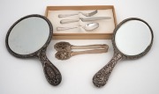 Two antique sterling silver hand-mirrors; together with a Continental silver three piece cutlery setting for one in original box and Viennese silver plated biscuit tongs, 19th and 20th century, the largest mirror 28.5cm high. - 2
