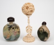 A Chinese carved ivory puzzle ball on stand; together with two glass scent bottles, early to mid 20th century, (3 items), the puzzle balls 14cm high. - 2