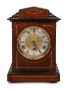 An antique German mantle clock in inlaid mahogany case, three train time and gong strike movement with Roman numerals, circa 1900, 38cm high.