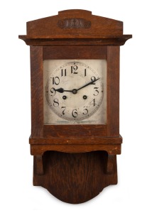An antique German oak cased wall clock with time and strike movement, silvered dial with Arabic numerals, early 20th century, 55cm high.