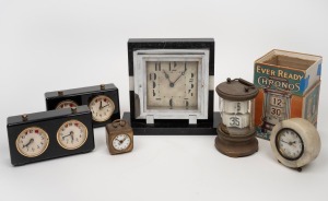 A marble and black slate Art Deco table clock, two chess clocks, a circular marble German table clock and a German miniature bedside alarm clock; together with an Ever Ready Chronos Flip Clock, 20th century, (6 items), the largest 18cm high.