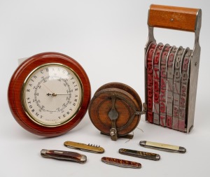 Five assorted pocket-knives, an antique timber fishing reel, a wall barometer and an oversized vintage office hand stamp, 20th century, (8 items), the stamp 28cm high.
