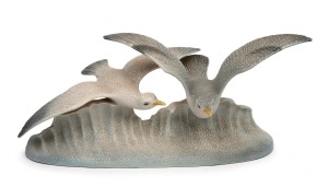 A vintage porcelain seagull and wave figure group, mid 20th century, 22cm high, 53cm wide.