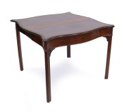 An antique English Chippendale period serpentine fronted mahogany card table with wool lined gaming surface and concertina action support, circa 1770, 74cm high, 94cm wide, 47cm deep. - 2