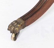 An antique Regency mahogany sofa table, the cantered corner mahogany top crossbanded with rosewood, ebony and boxwood stringing, two drawers to the frieze, turned support base with quadraform splay legs terminating on brass lion paw castors, circa 1825, 7 - 4