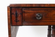 An antique Regency mahogany sofa table, the cantered corner mahogany top crossbanded with rosewood, ebony and boxwood stringing, two drawers to the frieze, turned support base with quadraform splay legs terminating on brass lion paw castors, circa 1825, 7 - 5