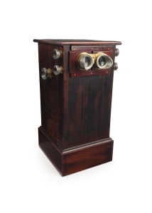 WWII ALLIED BOMBING RAIDS: A tabletop stereoscope, height 52.5cm, purported to have been owned by Royal Air Force Marshal Arthur Harris, loaded with 50 stereo transparencies (dated 1943-45) on chain drive operated by external knob; views mostly show the d