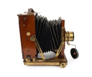 THORNTON-PICKARD: "Imperial" triple-extension view camera, late 19th century, plate dimensions 12 x 16.5cm, with rare Voigtl&auml;nder & Sohn Collinear II f5.4 No. 4 brass lens and "Baker & Rouse" retailer's inlay. - 2
