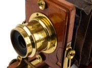 LANCASTER: "Instantograph" view camera, late 19th century, plate dimensions 11.5 x 16.5cm, fixed-aperture Lancaster brass lens, burgundy bellows, unusual rear hinge mechanism. - 3