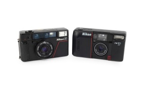 NIPPON KOGAKU: Pair of 1980s plastic point-and-shoot cameras, comprising Nikon L35 AF and Nikon TW20 AF. (2 items)