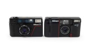 NIPPON KOGAKU: Pair of 1980s plastic point-and-shoot cameras, comprising Nikon L35 AF and Nikon TW20 AF. (2 items) - 2