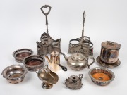 Assorted silver plated table ware including decanter stands, biscuit barrel, candle holders, Robur teapot and wine bottle coasters, 19th/20th century, (qty), the largest 41cm high.