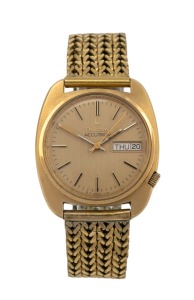 BULOVA "Accutron" (tuning fork) automatic wristwatch with baton numerals and day/date calendar window, 35mm wide including crown.
