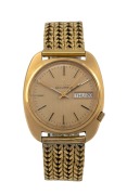 BULOVA "Accutron" (tuning fork) automatic wristwatch with baton numerals and day/date calendar window, 35mm wide including crown.