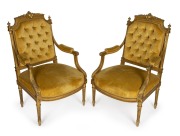 A pair of antique French Louis XVI style gilded armchairs with handsome carved decoration and gold velvet upholstery, 19th century, ​​​​​​​100cm high, 61cm across the arms.