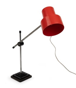 A vintage desk lamp with red plastic shade, circa 1970, ​​​​​​​65cm high.