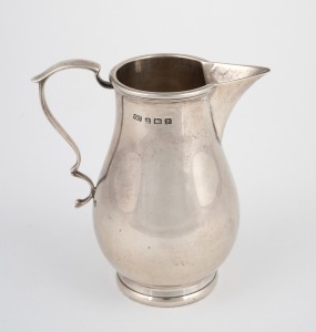 An antique sterling silver sparrow beak jug, made in the George III style, Birmingham, circa 1923, 10.5cm high, 184 grams.